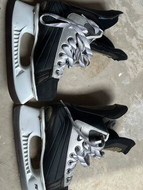 Nike Kids Black Hockey Skates with blade covers